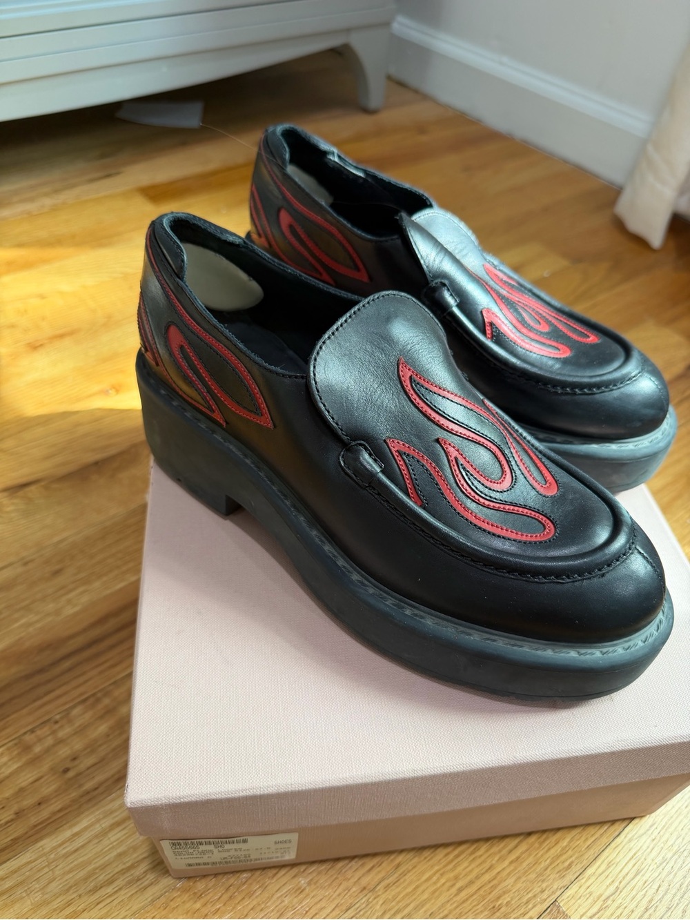 Miu Miu Black Leather Platform Loafers with Red Flame Stitching